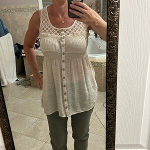 Beige sleeveless blouse.Perfect for the summer .